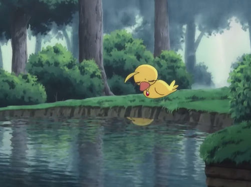 Ahiru, as a duck, sits in front of a pond in the woods, with her eyes closed. She has a sad expression. Princess Tutu's amulet is visible around her neck.